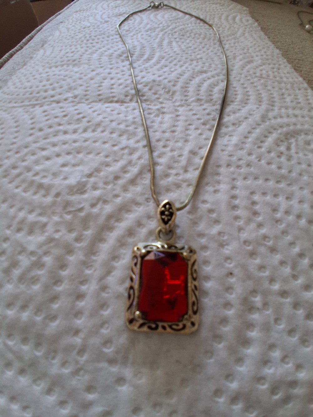 Gold-Tone Necklace with Red Rectangular Gem Pendant and Ornate Frame